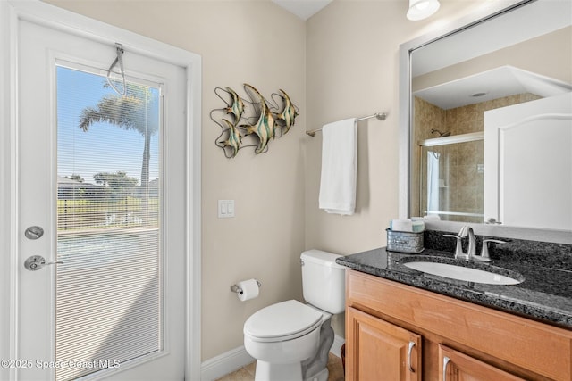 5770 Mascaro Ct, Melbourne, FL 32940 - bathroom with a shower stall, toilet, vanity, and baseboards