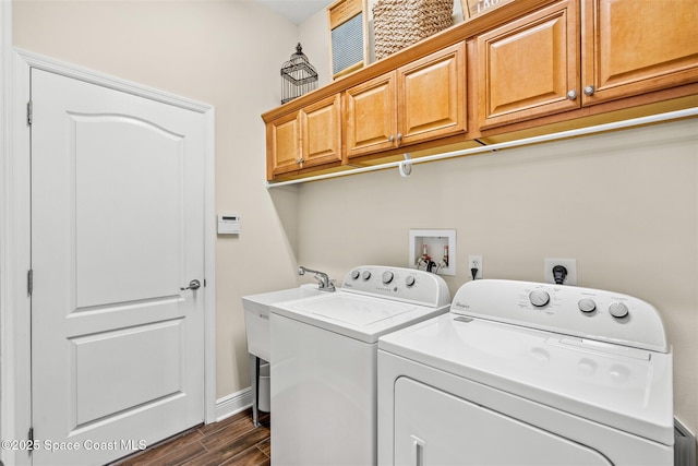5770 Mascaro Ct, Melbourne, FL 32940 - laundry room with cabinet space, washer and dryer, dark wood-style floors, and baseboards