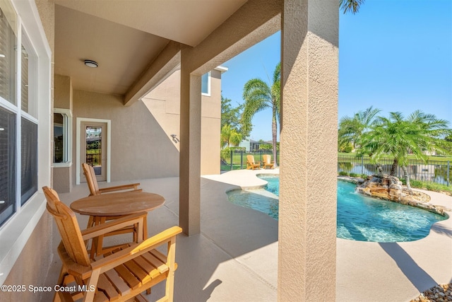 5770 Mascaro Ct, Melbourne, FL 32940 - view of swimming pool featuring a fenced backyard, a patio area, and a water view