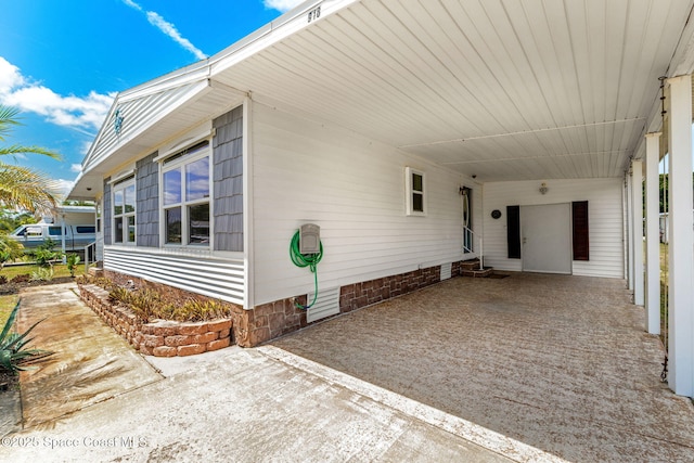 exterior space with a carport