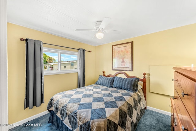 carpeted bedroom with baseboards and ceiling fan