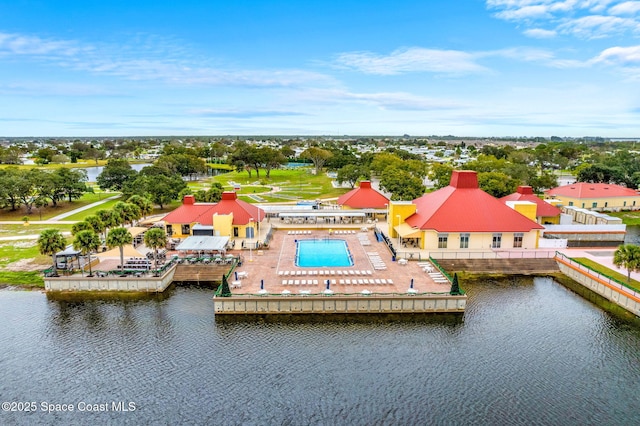 birds eye view of property with a water view