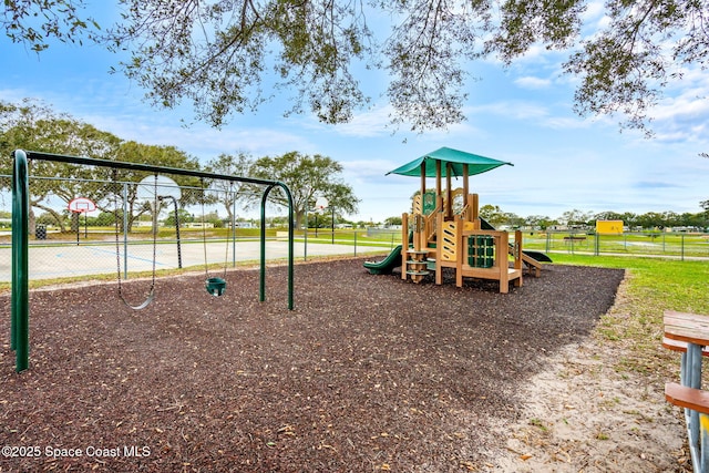 community jungle gym featuring fence