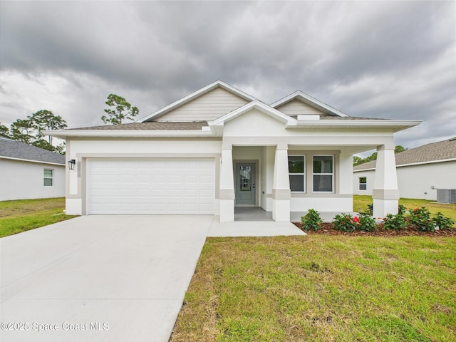view of front of home with concrete driveway, a front lawn, a garage, and central AC