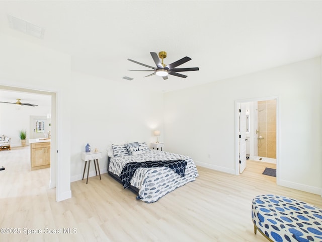 bedroom featuring baseboards, visible vents, and light wood-type flooring