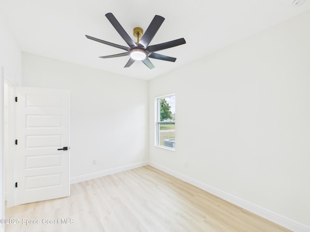 unfurnished room with baseboards, light wood finished floors, and a ceiling fan