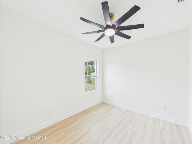 empty room featuring baseboards, light wood-style floors, and a ceiling fan