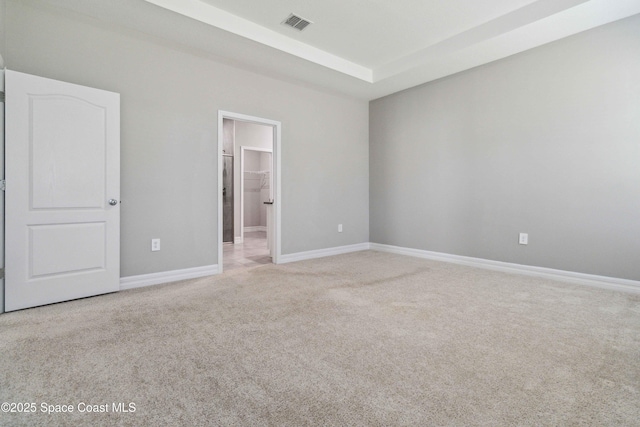 780 Geddes St SW, Palm Bay, FL 32908 - unfurnished bedroom with carpet, baseboards, and a walk in closet
