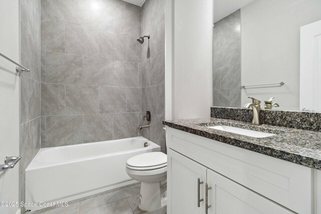 780 Geddes St SW, Palm Bay, FL 32908 - full bath with toilet, shower / bath combination, vanity, and tile patterned flooring