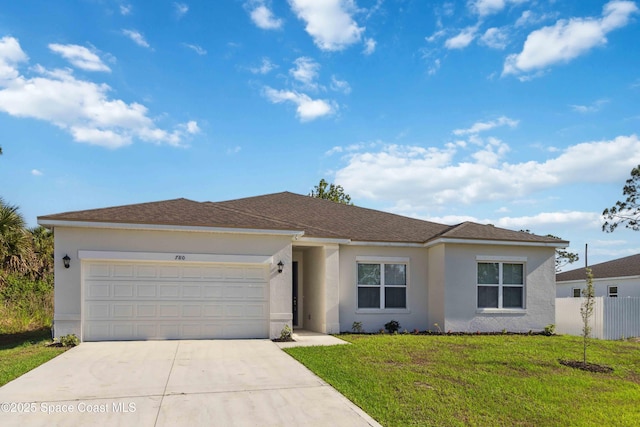 780 Geddes St SW, Palm Bay, FL 32908 - single story home with driveway, an attached garage, and stucco siding