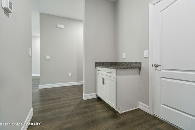 780 Geddes St SW, Palm Bay, FL 32908 - corridor with dark wood-style flooring and baseboards