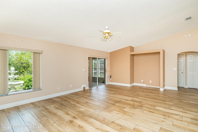 766 Preakness Dr, Melbourne, FL 32904 - spare room featuring vaulted ceiling, light wood-style flooring, arched walkways, and a ceiling fan