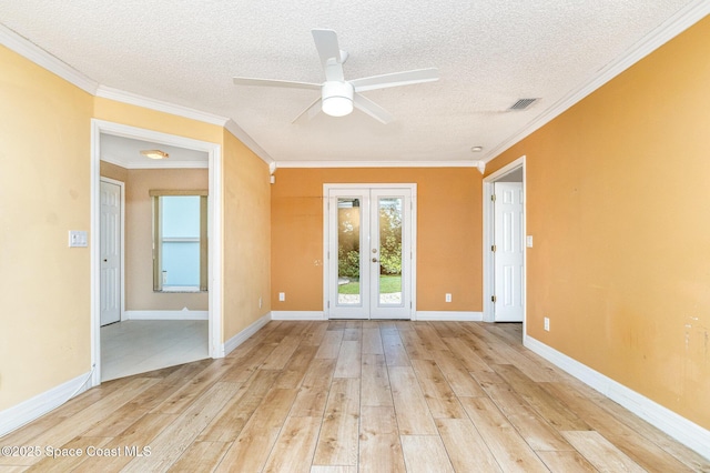 766 Preakness Dr, Melbourne, FL 32904 - empty room with a textured ceiling, french doors, a ceiling fan, and light wood-style floors