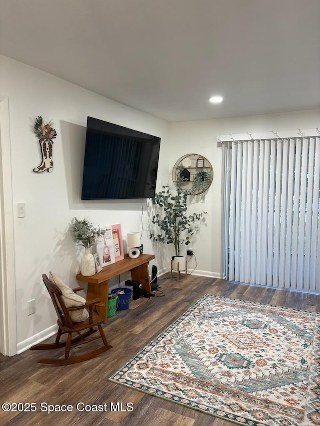 interior space featuring baseboards, recessed lighting, and wood finished floors