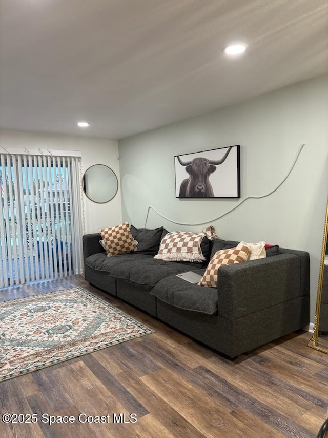 living room with recessed lighting and wood finished floors