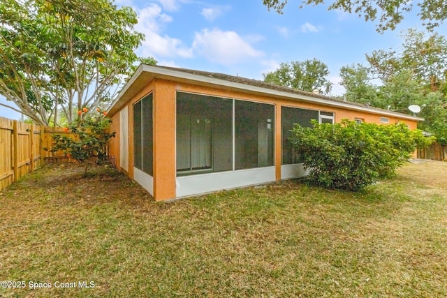 back of property featuring a sunroom