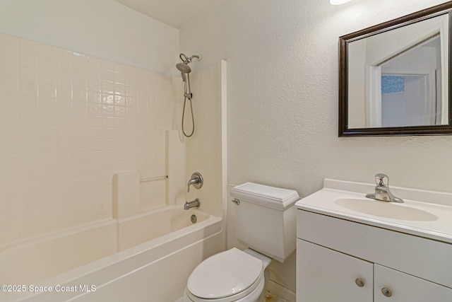 bathroom with toilet, vanity, and bathtub / shower combination