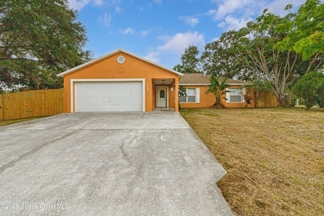 single story home featuring driveway, a garage, and stucco siding