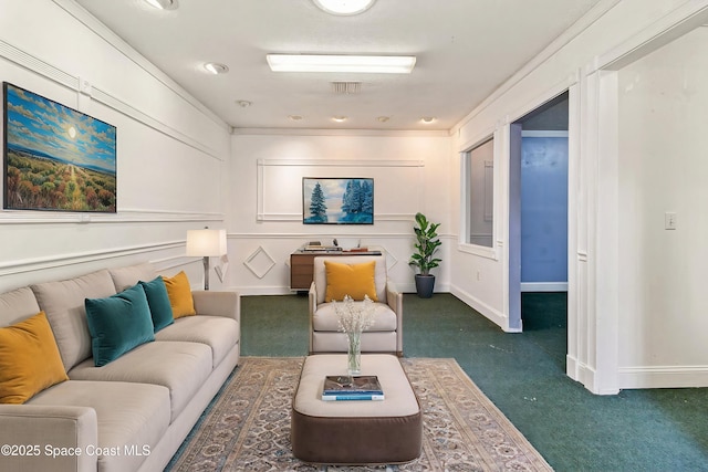 living area with dark colored carpet and baseboards