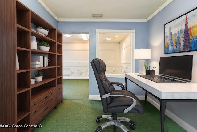 carpeted office featuring crown molding and baseboards