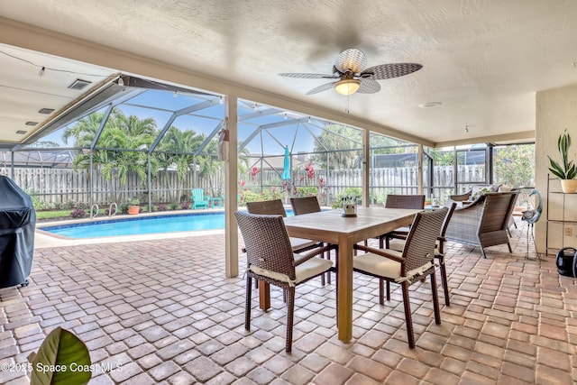 sunroom featuring ceiling fan, outdoor dining area, visible vents, and a swimming pool