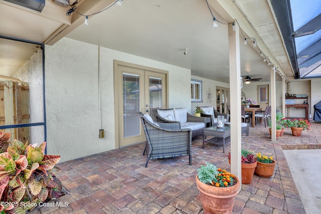 view of patio / terrace featuring outdoor lounge area, outdoor dining space, french doors, and ceiling fan