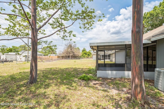 1680 Travis St SE, Palm Bay, FL 32909 - view of yard featuring a sunroom and cooling unit