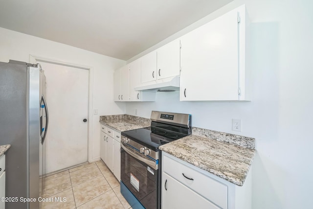 1680 Travis St SE, Palm Bay, FL 32909 - kitchen with appliances with stainless steel finishes, under cabinet range hood, white cabinetry, light stone countertops, and light tile patterned floors