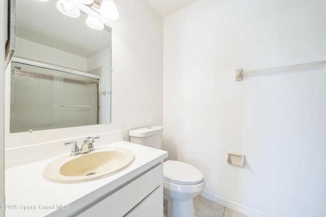1680 Travis St SE, Palm Bay, FL 32909 - bathroom with toilet, vanity, an enclosed shower, and tile patterned floors