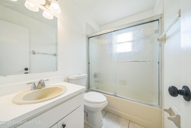 1680 Travis St SE, Palm Bay, FL 32909 - full bath featuring vanity, toilet, bath / shower combo with glass door, and tile patterned floors