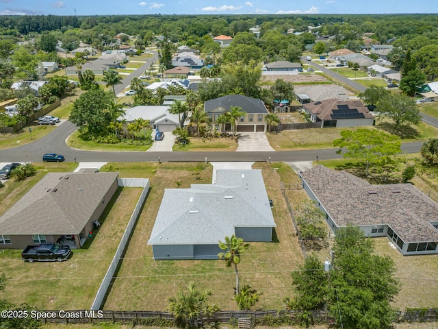 birds eye view of property with a residential view