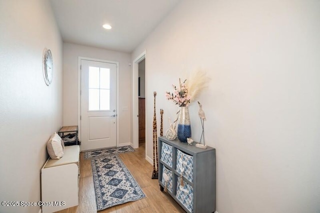 2979 Pangea Cir, Melbourne, FL 32940 - doorway with light wood-style flooring, recessed lighting, and baseboards