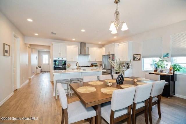 2979 Pangea Cir, Melbourne, FL 32940 - dining space featuring a chandelier, plenty of natural light, light wood-type flooring, and recessed lighting
