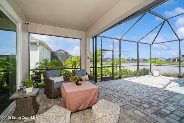 2979 Pangea Cir, Melbourne, FL 32940 - view of patio featuring glass enclosure, a water view, and a residential view