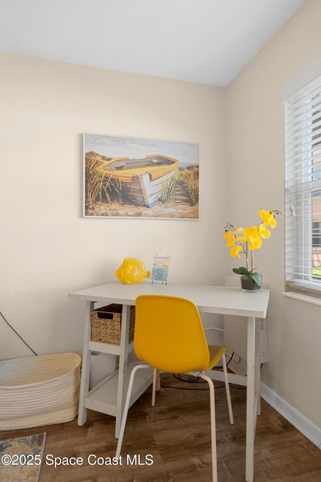 home office featuring baseboards and wood finished floors