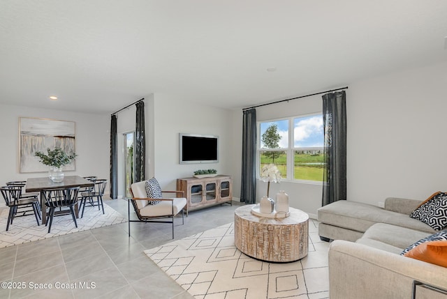 living room featuring light tile patterned flooring and recessed lighting
