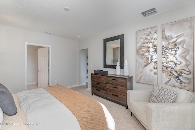 bedroom featuring light colored carpet, visible vents, and baseboards