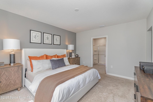 bedroom featuring light colored carpet, visible vents, and baseboards