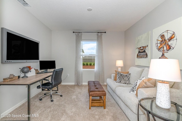 office with light carpet, baseboards, and visible vents