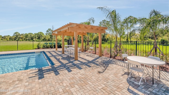 view of pool with a pergola, a patio, a fenced in pool, and fence