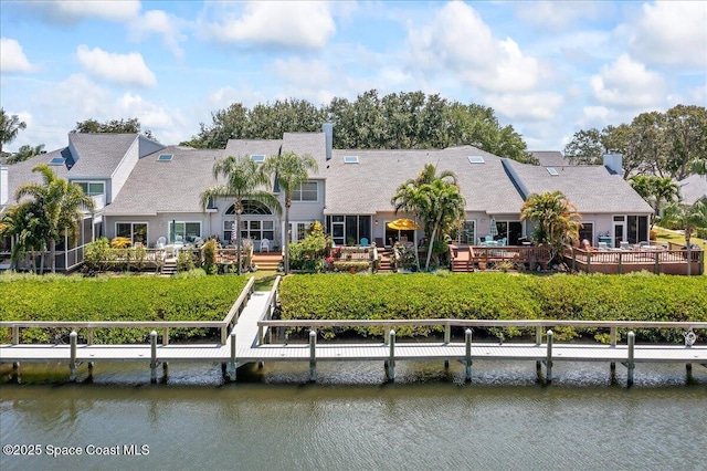 505 Tradewinds Dr, Indian Harbour Beach, FL 32937 - back of house with a deck with water view and a chimney