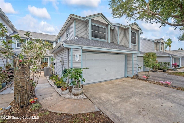 505 Tradewinds Dr, Indian Harbour Beach, FL 32937 - exterior space with central air condition unit, driveway, and a garage