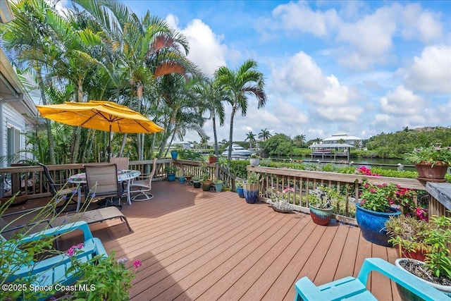 505 Tradewinds Dr, Indian Harbour Beach, FL 32937 - wooden terrace featuring a water view and outdoor dining area