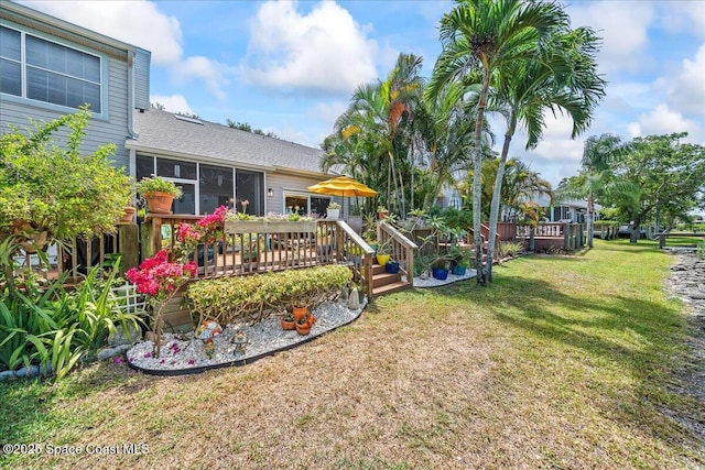 505 Tradewinds Dr, Indian Harbour Beach, FL 32937 - view of yard with a sunroom and a deck