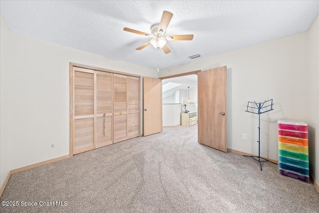 505 Tradewinds Dr, Indian Harbour Beach, FL 32937 - unfurnished bedroom with baseboards, carpet flooring, a closet, and visible vents