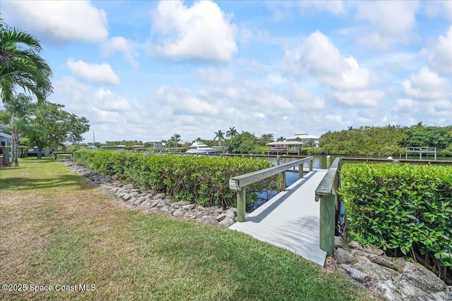 505 Tradewinds Dr, Indian Harbour Beach, FL 32937 - view of dock featuring a lawn