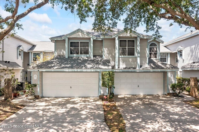 505 Tradewinds Dr, Indian Harbour Beach, FL 32937 - view of front of house with driveway and a garage