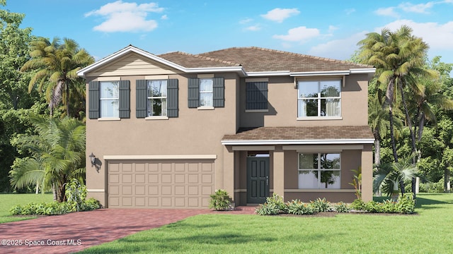 traditional-style home with a front yard, stucco siding, decorative driveway, and a garage