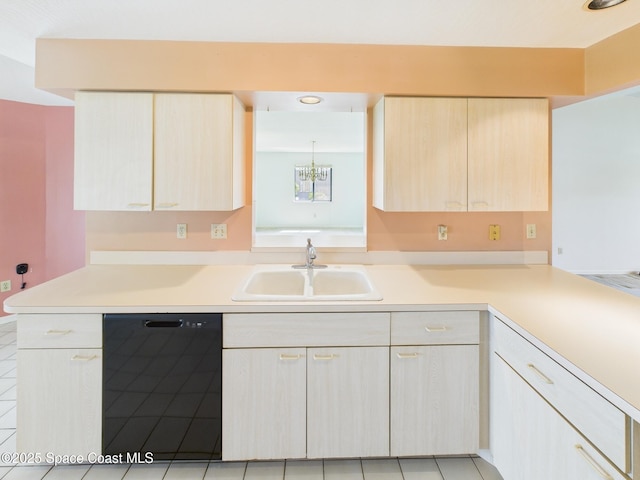 kitchen featuring light countertops, light brown cabinetry, a sink, dishwasher, and a chandelier