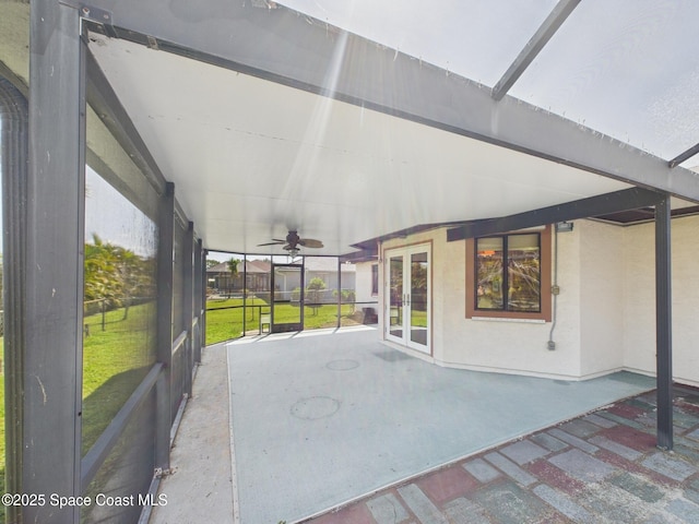 unfurnished sunroom with french doors